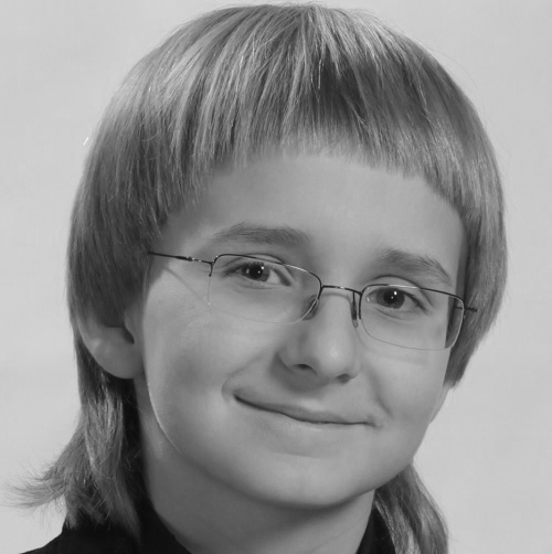 Black-and-white archival portrait of Alexander Denisov as a young musician