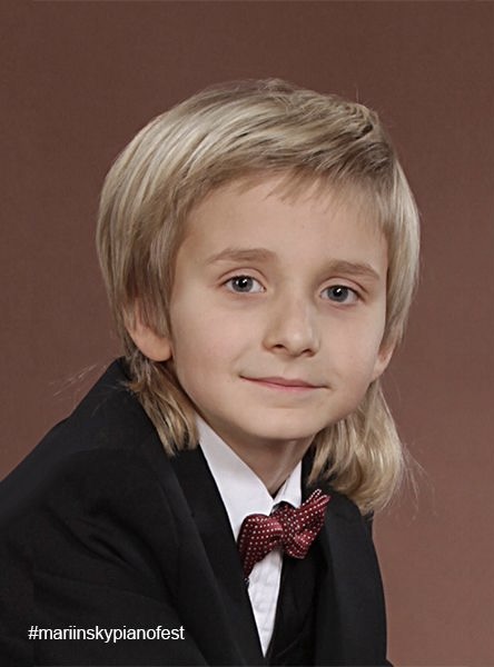 Childhood portrait of Alexander Denisov in concert attire